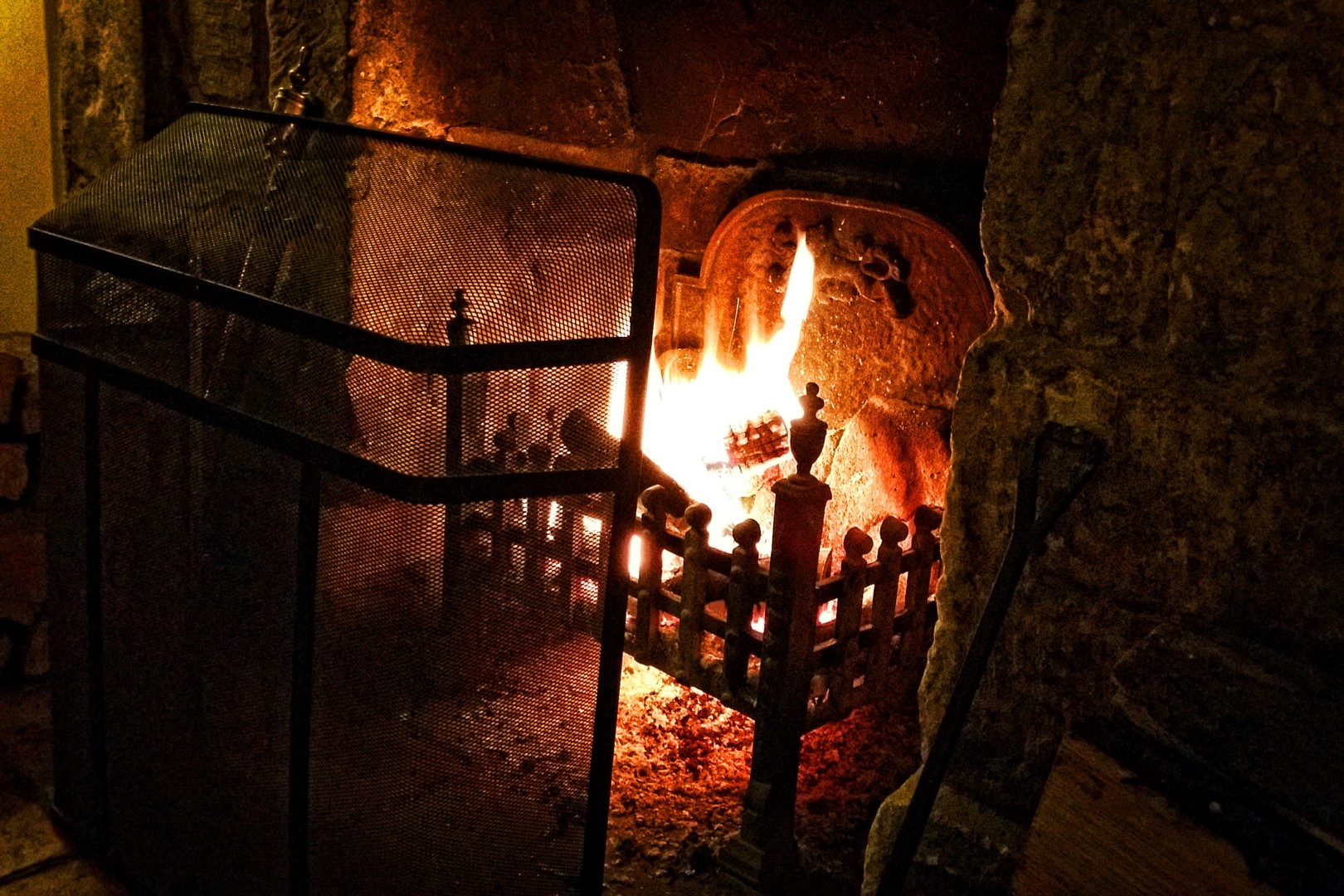 Enjoying-a-scotch-in-front-of-the-Charingworth-fireplace